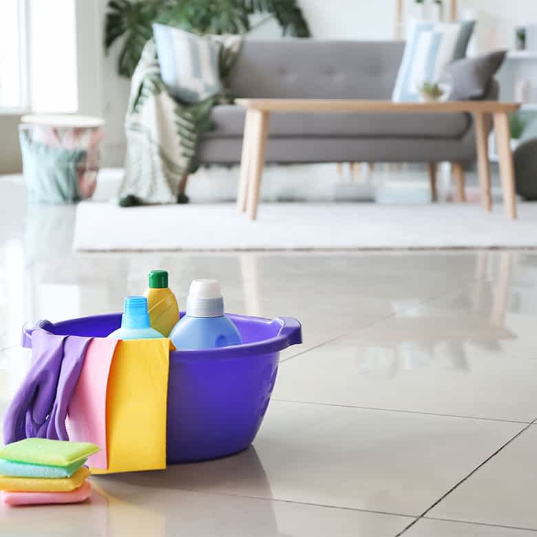 Professional cleaner sanitizing a kitchen in Bellevue home, Bellevue house cleaning concept