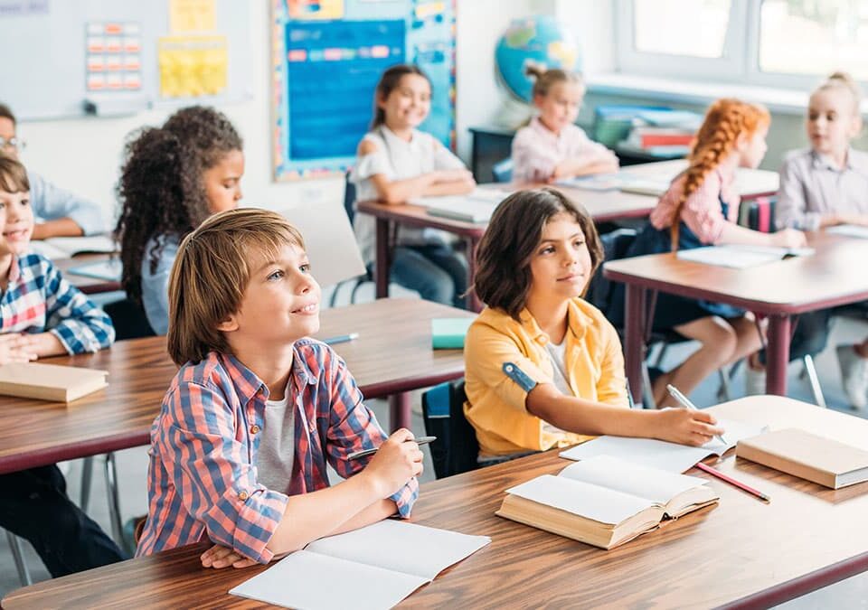 Elementary school students seated at classroom desks during back-to-school season in Bothell, WA.