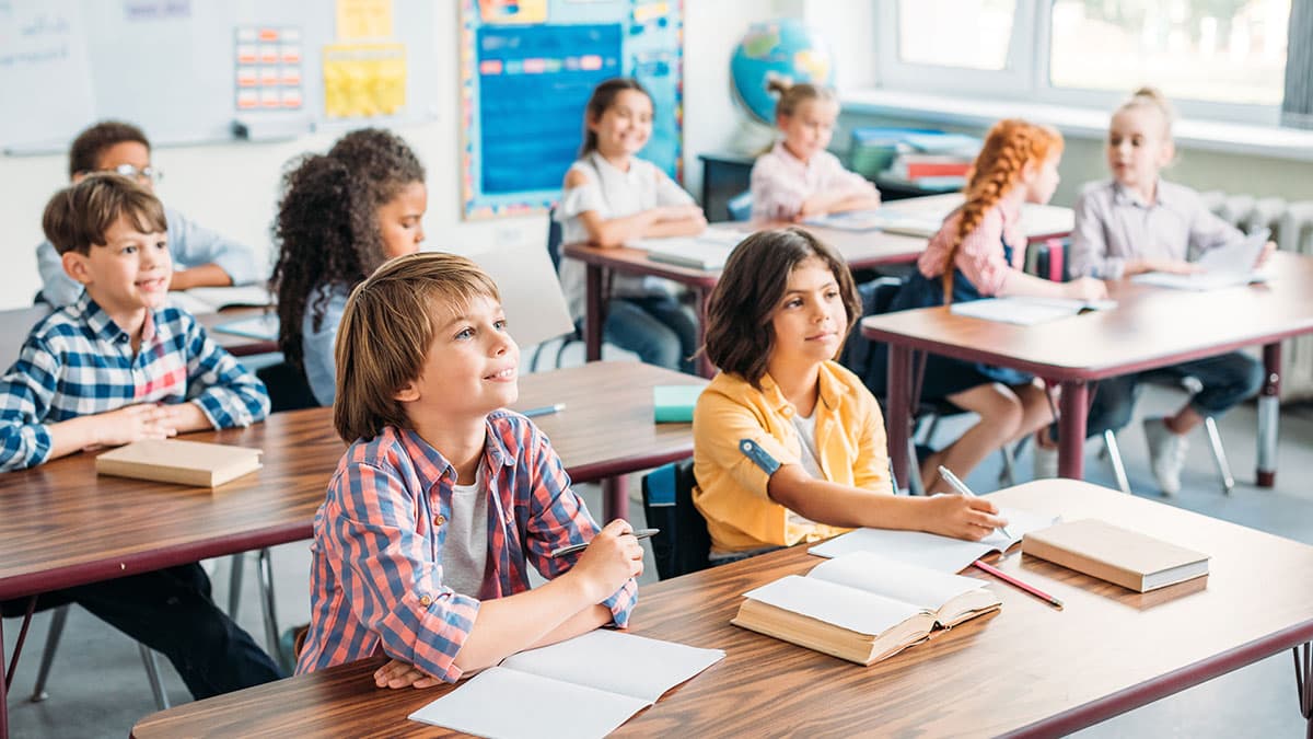 Elementary school students seated at classroom desks during back-to-school season in Bothell, WA.